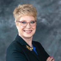 Melissa business suit short hair glasses