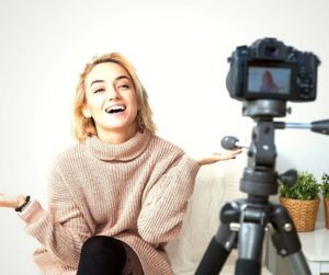 blond talking to a video camera